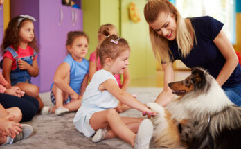 Happy child playing with dog